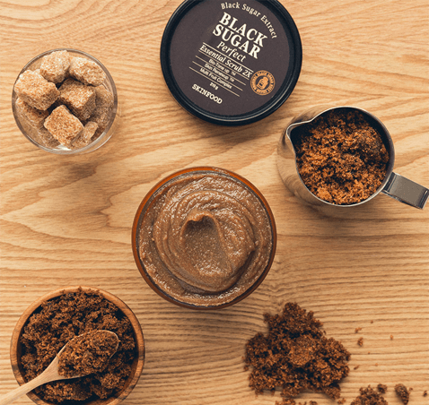 Black Sugar Perfect Essential Scrub 2X. A mask & scrub in one made with black sugar, rice wine, and fruit extracts to buff away dead skin cells for a smooth and bright complexion.